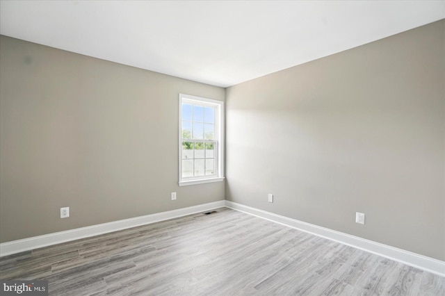 6624 Aaron Mee Way, Baltimore, MD 21237 - empty room featuring wood finished floors and baseboards