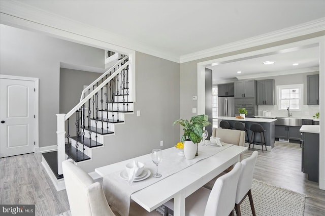 6624 Aaron Mee Way, Baltimore, MD 21237 - dining room with stairway, light wood-style flooring, crown molding, baseboards, and recessed lighting