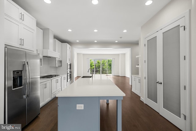 42289 Porter Rdg, Brambleton, VA 20148 - kitchen with appliances with stainless steel finishes, white cabinets, light countertops, and recessed lighting