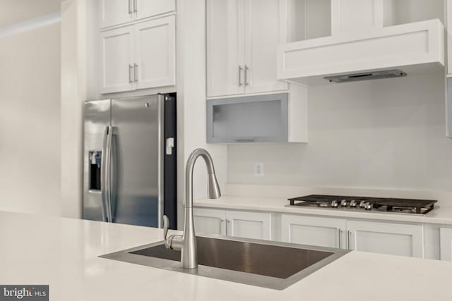 42289 Porter Rdg, Brambleton, VA 20148 - kitchen featuring stainless steel appliances, a sink, white cabinetry, and light countertops
