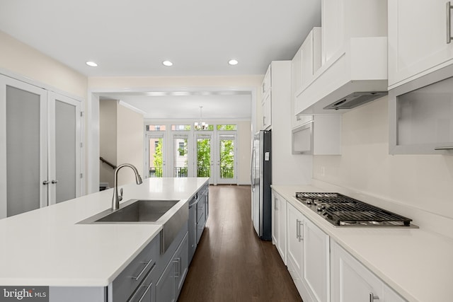 42289 Porter Rdg, Brambleton, VA 20148 - kitchen with a sink, stainless steel appliances, a chandelier, light countertops, and recessed lighting