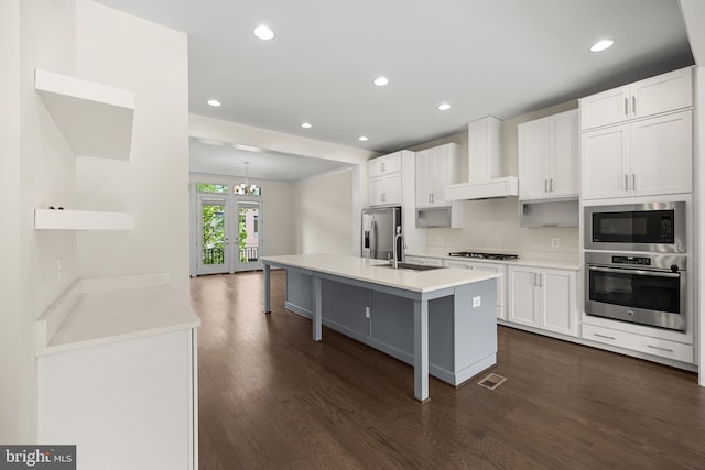 42289 Porter Rdg, Brambleton, VA 20148 - kitchen featuring stainless steel appliances, dark wood finished floors, white cabinets, recessed lighting, and light countertops