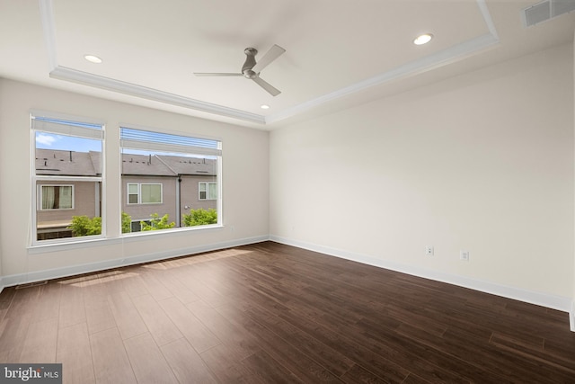 42289 Porter Rdg, Brambleton, VA 20148 - empty room with a raised ceiling, ceiling fan, dark wood finished floors, recessed lighting, and ornamental molding