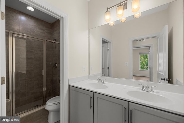 42289 Porter Rdg, Brambleton, VA 20148 - bathroom with a stall shower, toilet, double vanity, and tile patterned flooring