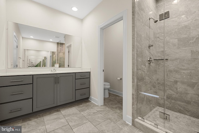 42289 Porter Rdg, Brambleton, VA 20148 - bathroom featuring a stall shower, toilet, vanity, and baseboards