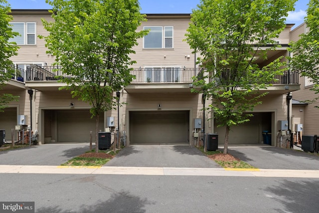 42289 Porter Rdg, Brambleton, VA 20148 - view of front of property with cooling unit, driveway, and a garage