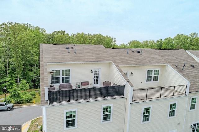 rear view of house with a balcony