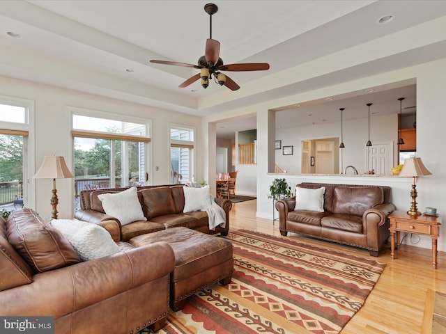 living room featuring wood finished floors, ceiling fan, recessed lighting, and baseboards