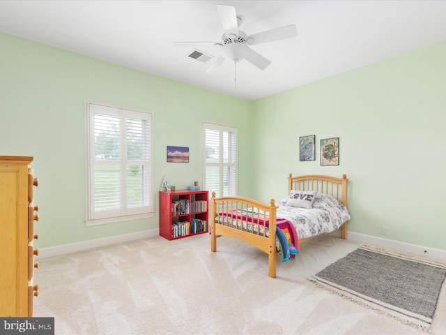 bedroom featuring baseboards, carpet floors, and ceiling fan