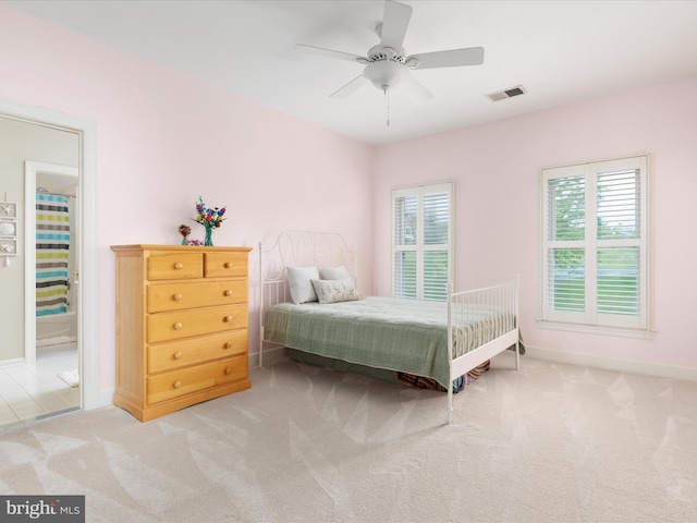 carpeted bedroom with baseboards and a ceiling fan