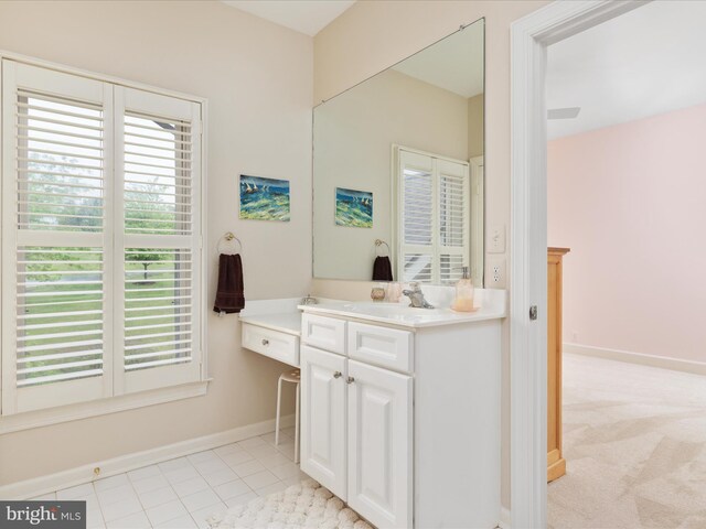 bathroom featuring vanity and baseboards