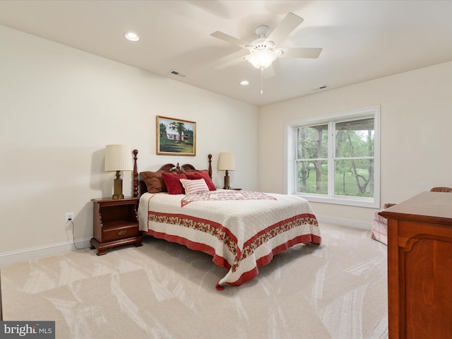 bedroom featuring light colored carpet, baseboards, recessed lighting, and a ceiling fan