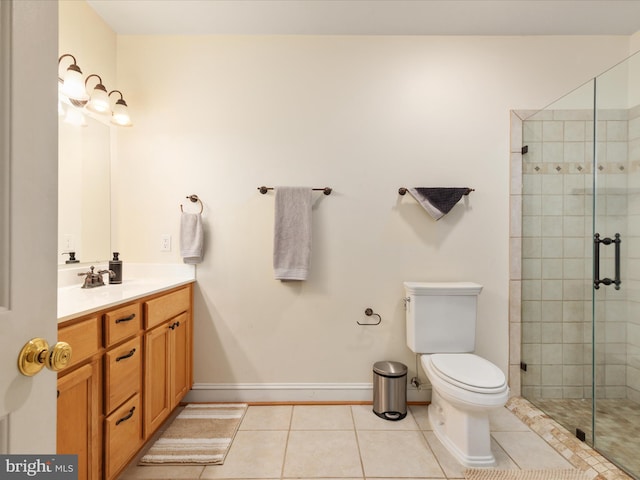 full bathroom featuring tile patterned floors, toilet, a stall shower, and vanity