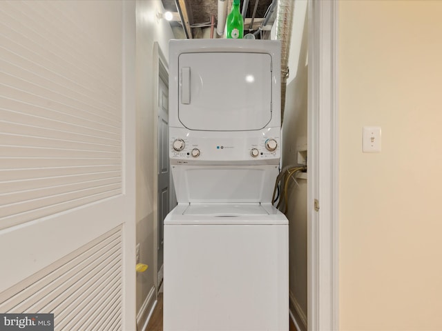 laundry area with stacked washer / dryer