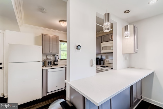 6328 Martin Luther King Jr Hwy, Capitol Heights, MD 20743 - kitchen with white appliances, light countertops, crown molding, decorative light fixtures, and a kitchen bar