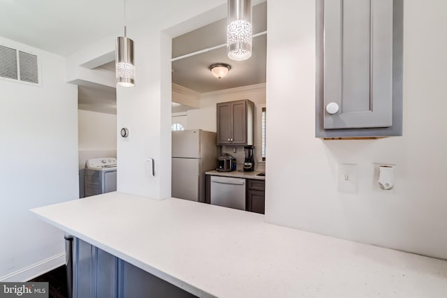6328 Martin Luther King Jr Hwy, Capitol Heights, MD 20743 - kitchen with dishwasher, freestanding refrigerator, light countertops, a peninsula, and hanging light fixtures