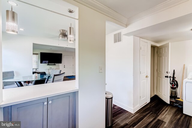 6328 Martin Luther King Jr Hwy, Capitol Heights, MD 20743 - kitchen with dark wood-style flooring, ornamental molding, baseboards, hanging light fixtures, and light countertops