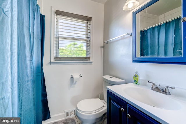 6328 Martin Luther King Jr Hwy, Capitol Heights, MD 20743 - bathroom with toilet, vanity, baseboards, and a shower with curtain