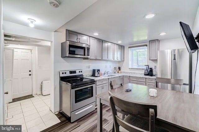6328 Martin Luther King Jr Hwy, Capitol Heights, MD 20743 - kitchen with stainless steel appliances, gray cabinetry, a sink, recessed lighting, and tile patterned flooring