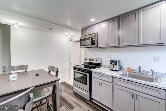 6328 Martin Luther King Jr Hwy, Capitol Heights, MD 20743 - kitchen featuring stainless steel appliances, gray cabinetry, a sink, light wood-style floors, and recessed lighting