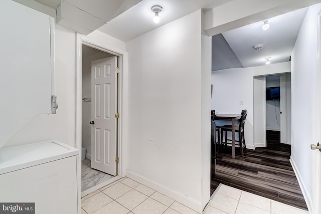 6328 Martin Luther King Jr Hwy, Capitol Heights, MD 20743 - corridor featuring baseboards, washer / clothes dryer, and light tile patterned floors
