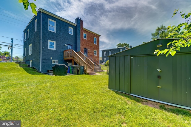 6328 Martin Luther King Jr Hwy, Capitol Heights, MD 20743 - rear view of property with stairway, a lawn, and a chimney