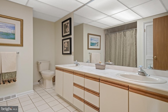 3731 Long Point Dr, York, PA 17402 - bathroom featuring double vanity, toilet, tile patterned floors, baseboards, and a shower with curtain