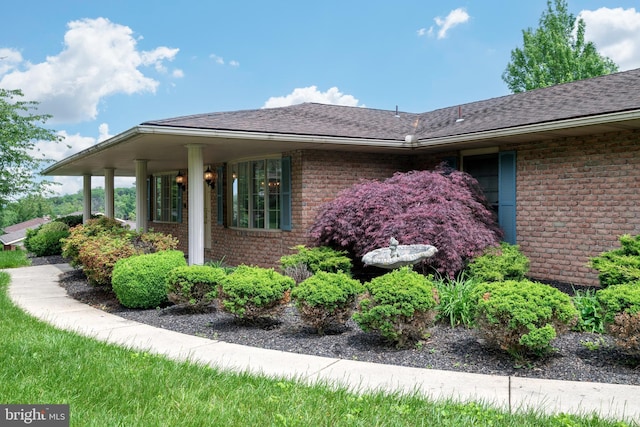 3731 Long Point Dr, York, PA 17402 - view of property exterior featuring brick siding and roof with shingles