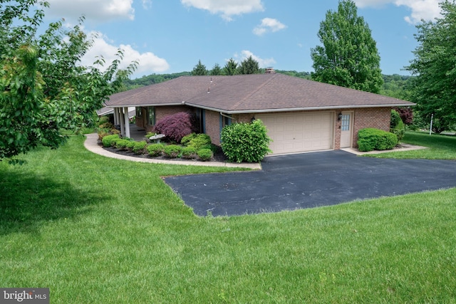 3731 Long Point Dr, York, PA 17402 - view of front of home featuring brick siding, driveway, an attached garage, and a front lawn