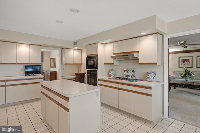 3731 Long Point Dr, York, PA 17402 - kitchen featuring black appliances, light countertops, under cabinet range hood, ceiling fan, and a center island
