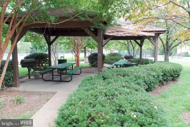 surrounding community with a gazebo and fence