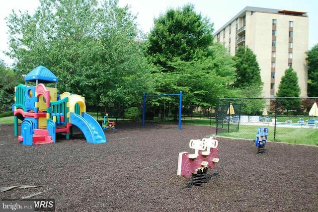 community jungle gym featuring fence