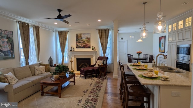 16 Magpie Ln, Princeton Junction, NJ 08550 - living area with healthy amount of natural light, ceiling fan, crown molding, a fireplace, and recessed lighting