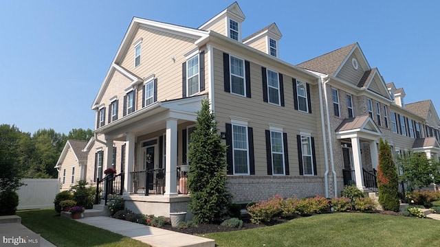16 Magpie Ln, Princeton Junction, NJ 08550 - view of front of house featuring covered porch, a front yard, and brick siding