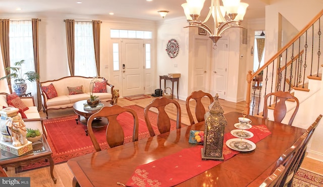 16 Magpie Ln, Princeton Junction, NJ 08550 - dining area featuring a chandelier, crown molding, stairway, wood finished floors, and recessed lighting