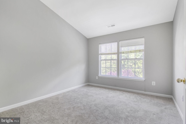 unfurnished room with carpet floors and baseboards