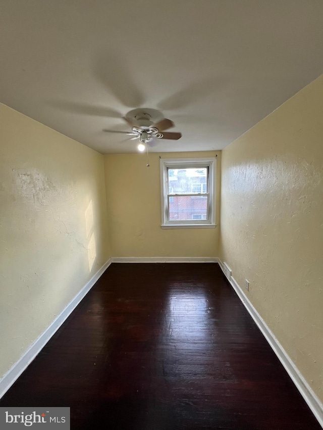 1128 Elbridge St, Philadelphia, PA 19111 - spare room with wood finished floors, baseboards, a ceiling fan, and a textured wall