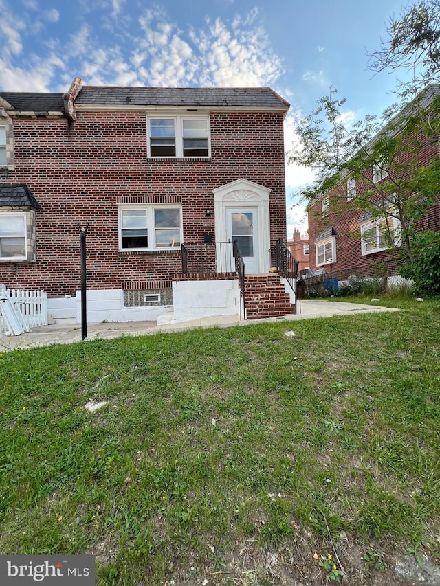1128 Elbridge St, Philadelphia, PA 19111 - view of front of house featuring brick siding and a front yard