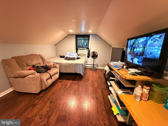 418 N 8th St, Vineland, NJ 08360 - bedroom featuring wood finished floors, baseboards, a baseboard heating unit, and vaulted ceiling