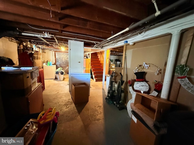 418 N 8th St, Vineland, NJ 08360 - unfinished below grade area featuring washer / dryer and stairway