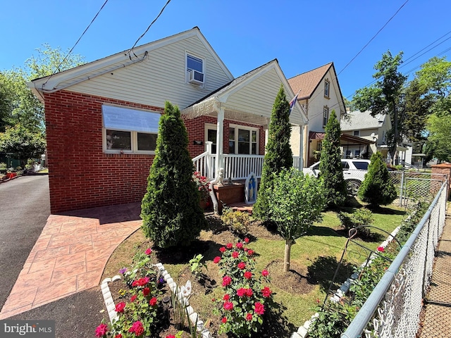 418 N 8th St, Vineland, NJ 08360 - rear view of house featuring brick siding, covered porch, and cooling unit