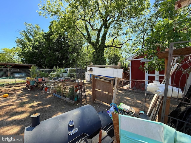 418 N 8th St, Vineland, NJ 08360 - view of yard with fence, a storage unit, and an outbuilding