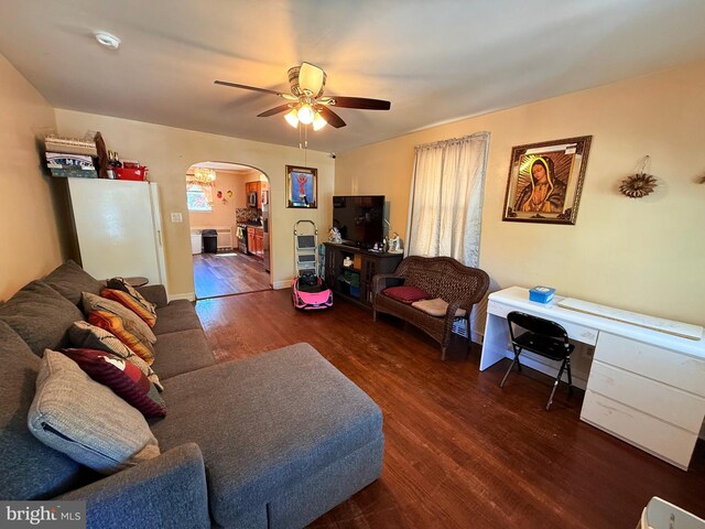 418 N 8th St, Vineland, NJ 08360 - living room with arched walkways, wood finished floors, and ceiling fan