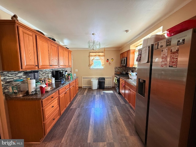 418 N 8th St, Vineland, NJ 08360 - kitchen featuring stainless steel appliances, brown cabinets, decorative backsplash, dark wood-style flooring, and radiator