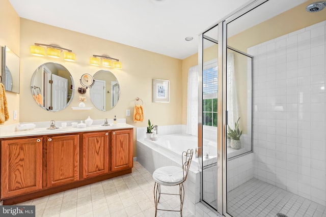 bathroom featuring a shower stall, a garden tub, tile patterned floors, and double vanity