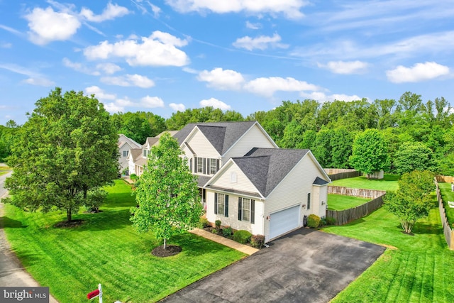 view of front of house with driveway, roof with shingles, and a garage