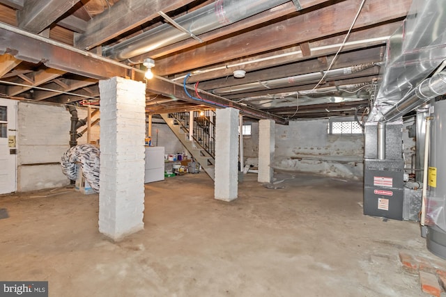 5100 Eugene Ave, Baltimore, MD 21206 - basement with stairway, heating unit, washer / dryer, and gas water heater