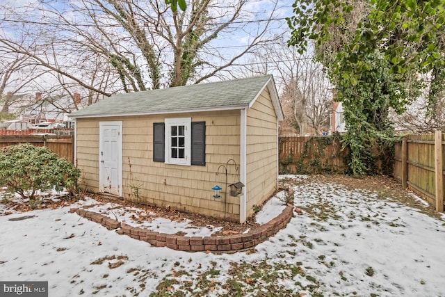 5100 Eugene Ave, Baltimore, MD 21206 - snow covered structure featuring a fenced backyard and an outdoor structure