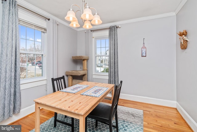 5100 Eugene Ave, Baltimore, MD 21206 - dining area with a chandelier, baseboards, wood finished floors, and crown molding