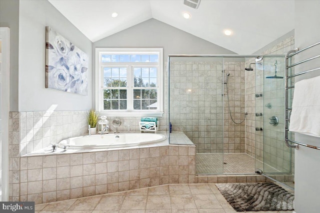 full bath featuring vaulted ceiling, a stall shower, a bath, and tile patterned flooring